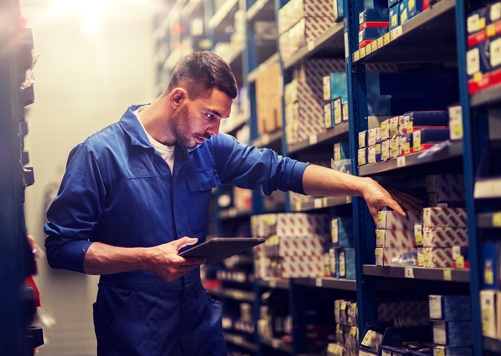 Warehouse Worker Reviewing Stock Levels | Inventor-e's Inventory & Asset Management Solutions | Avoid Inventory Mismanagement